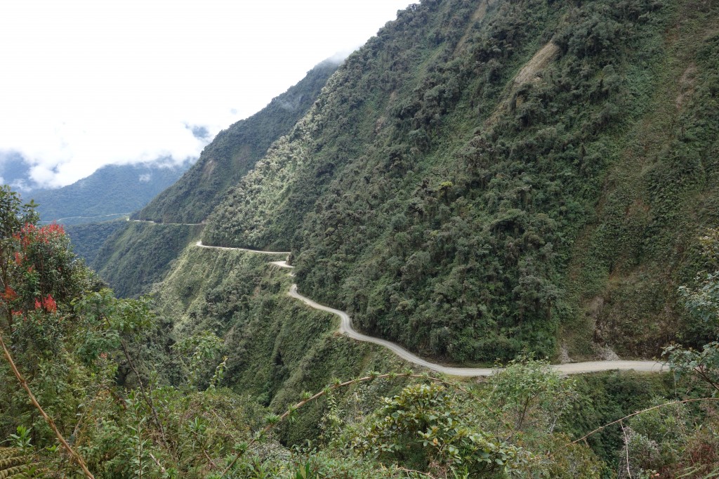 backpack, backpacking, budget, adventure, explore, U, university, world, campus, field, note, professor, South, America, Bolivia, La, Paz, Death, Road, Dangerous, Most, cliff, trail, path, bike, mountain, crash, down, valley, edge, ride, helmet